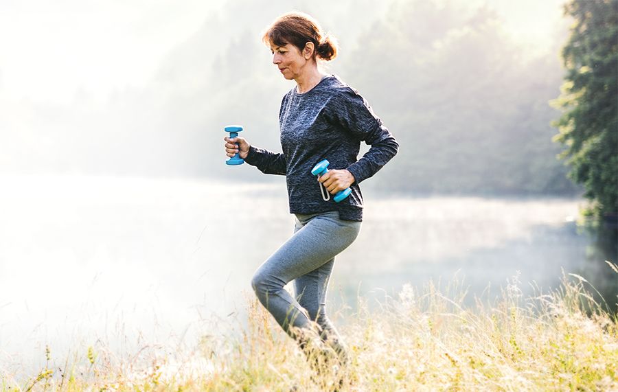 A woman with gout working out in nature.