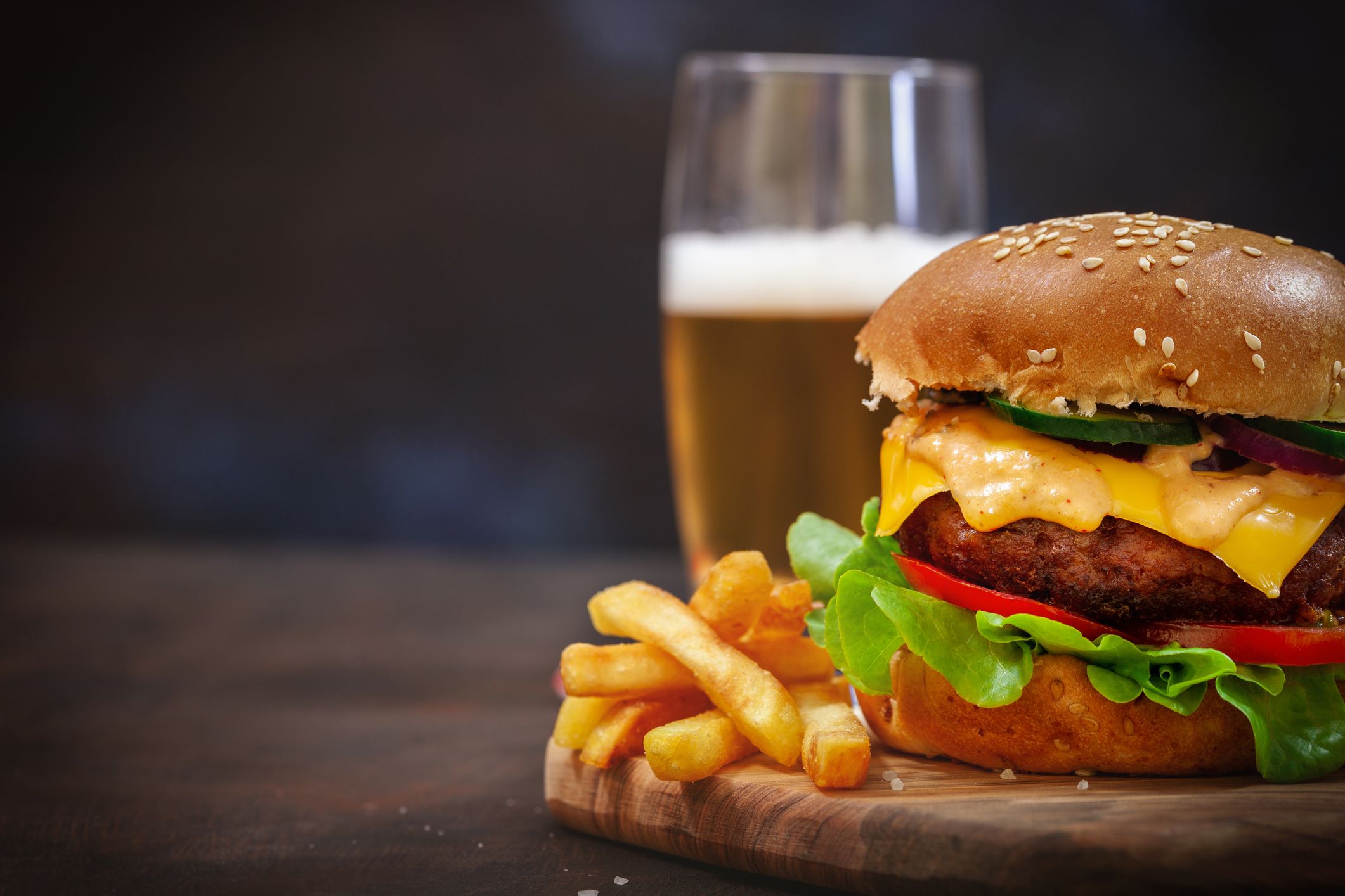 An image of a cheeseburger and fries.