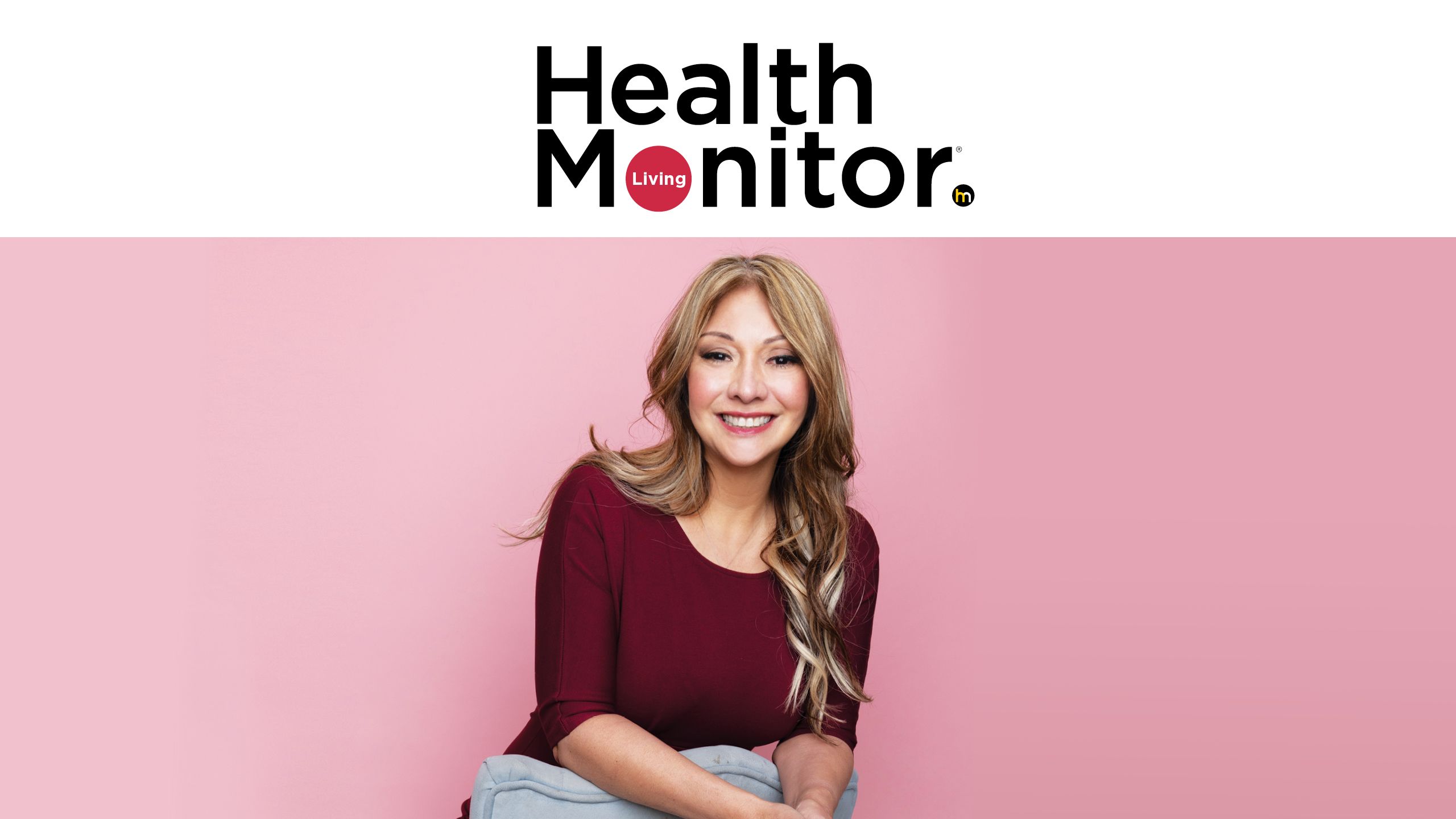 A woman with thyroid eye disease smiling under the Health Monitor logo.