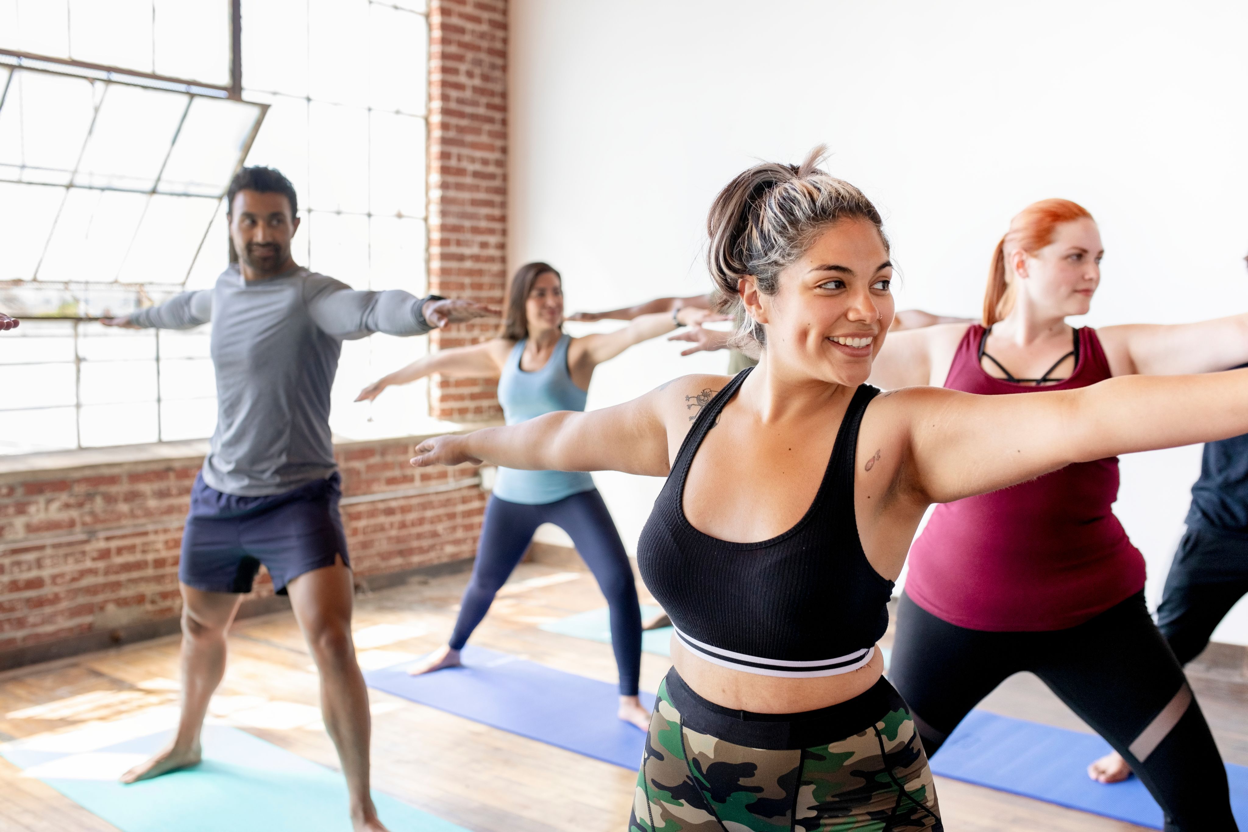 A class doing yoga in the studio. 
