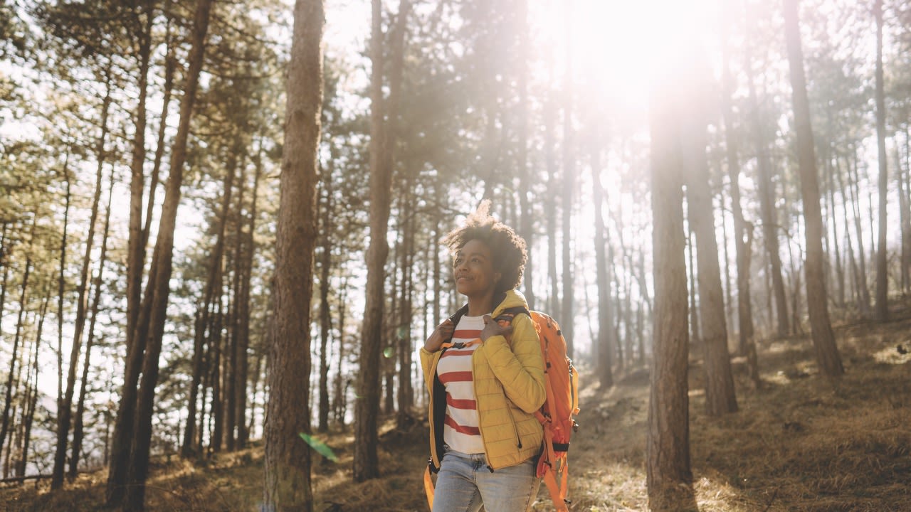 woman hiking in woods