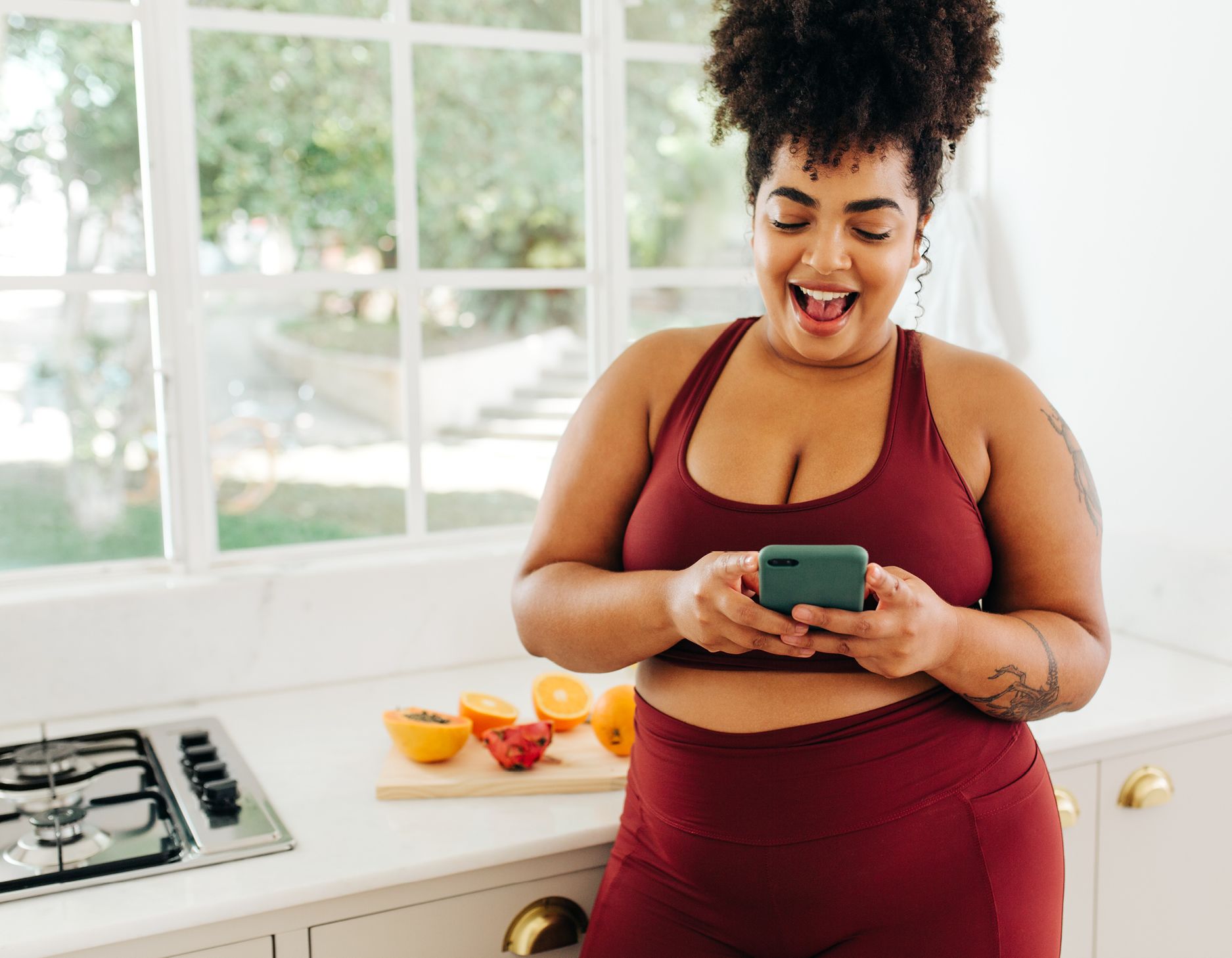 A woman being heart healthy and exercising while tracking her progress with an app.