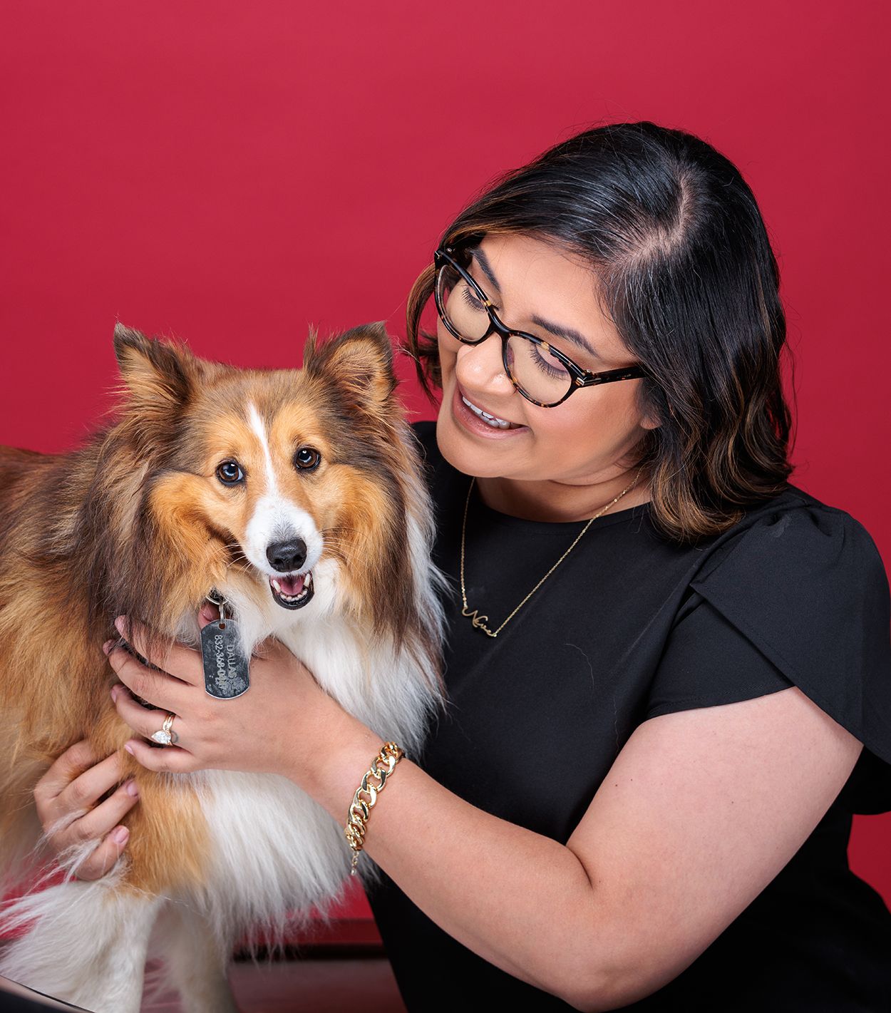 Alejandra (Ally) Lavalley posing with her dog.