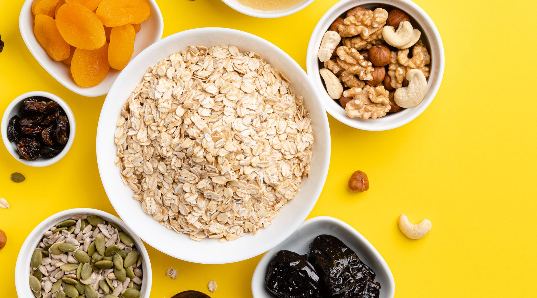 Heart healthy foods that can help lower your cholesterol. (Oatmeal, nuts, seeds, dates.)