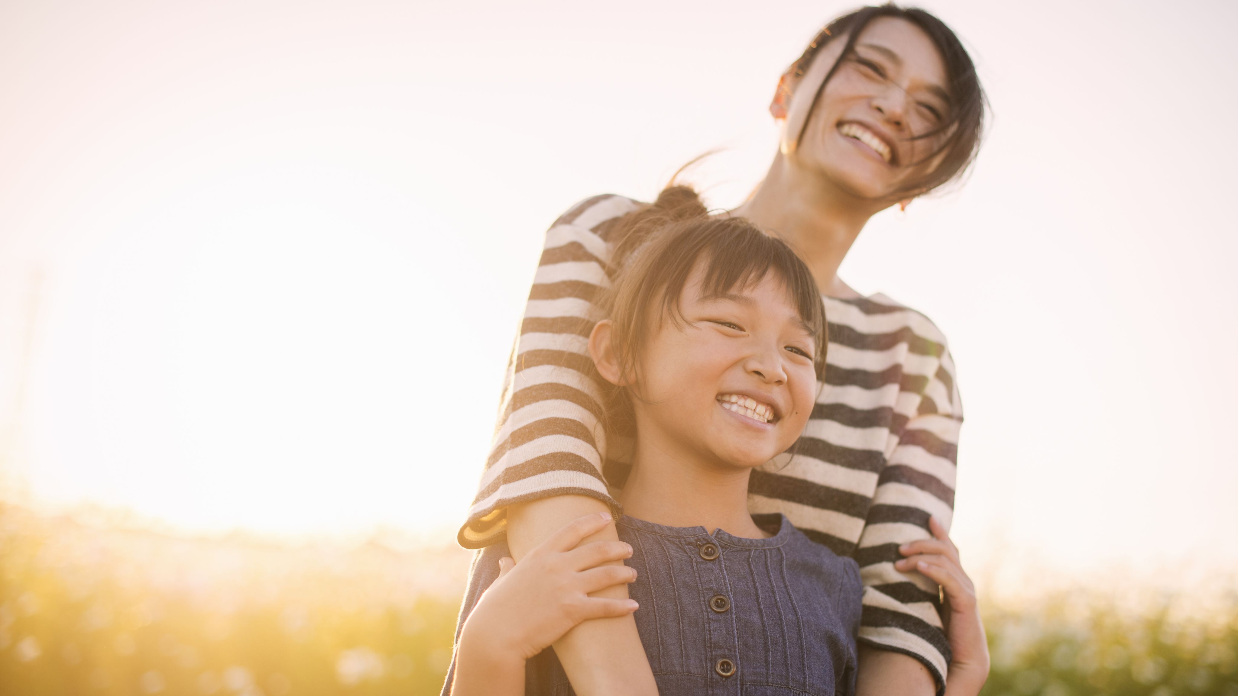 An image of a mother and child outside.