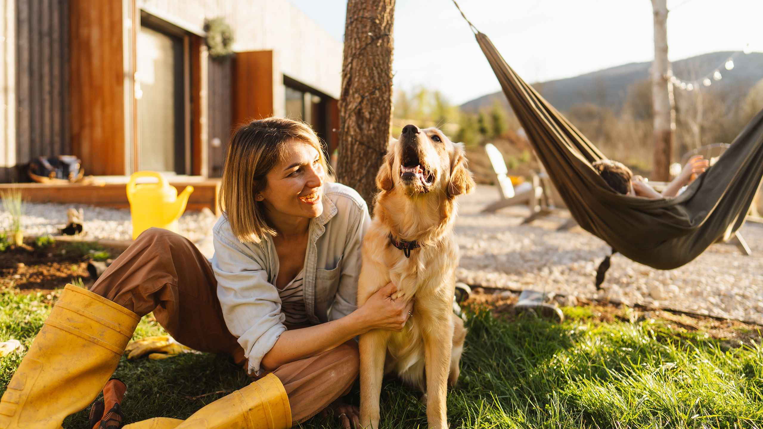 An image of a woman smiling with her dog.