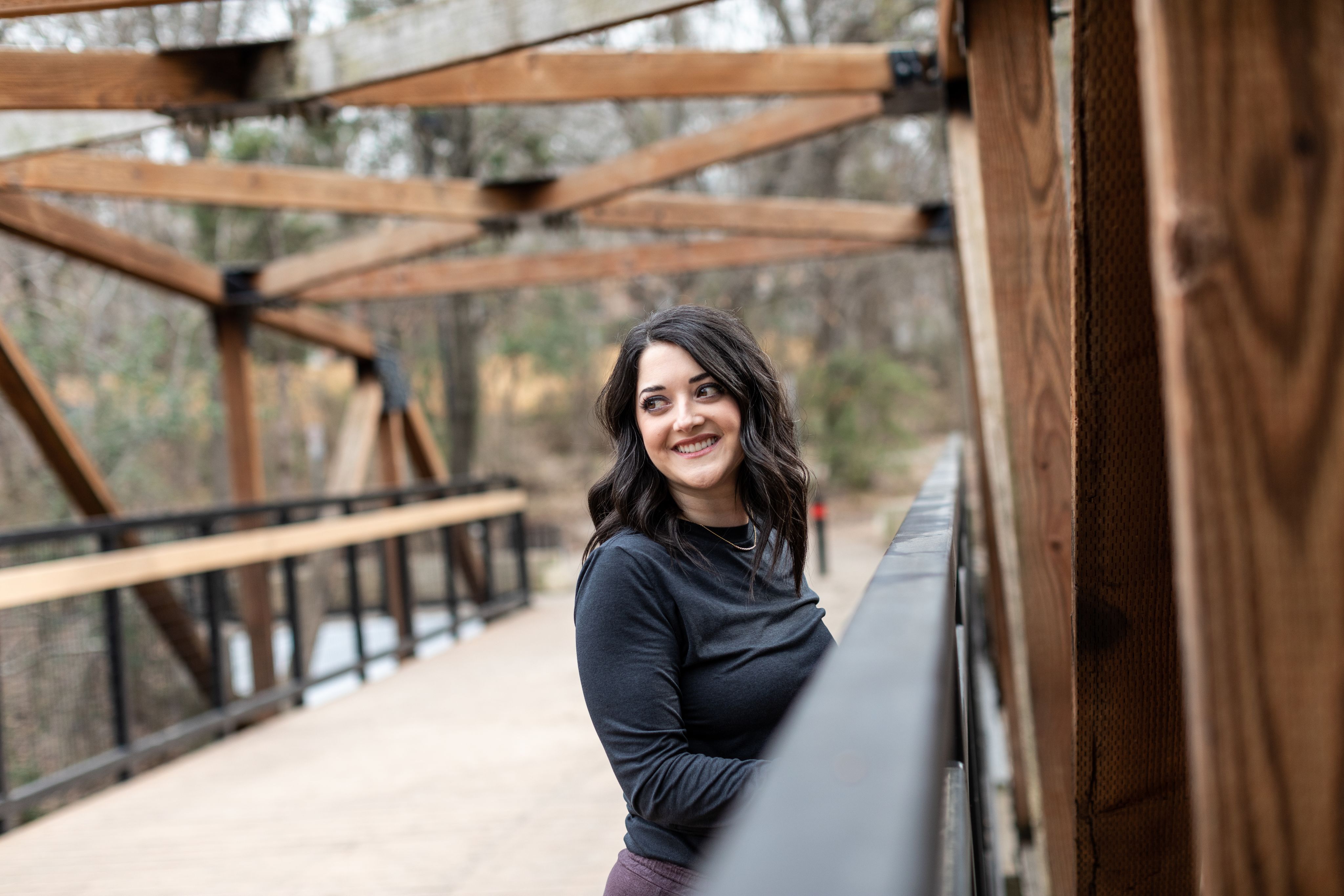 An image of a woman outside smiling.